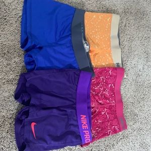 4 pairs of Nike pros